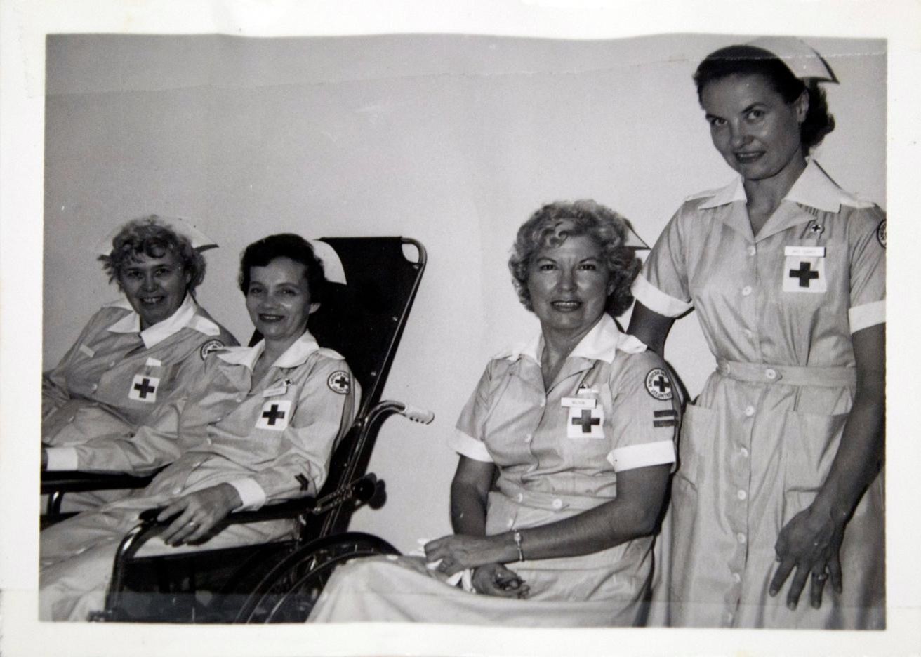 Historical photograph of hospital nurses smiling