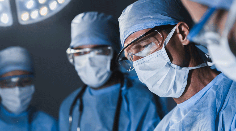 Close up on face of  concentrating surgeon