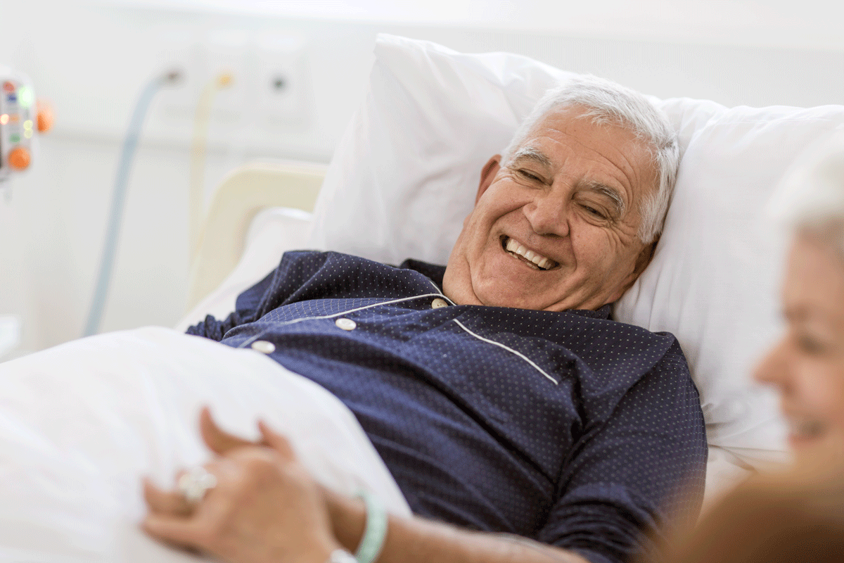 Happy senior man in hospital