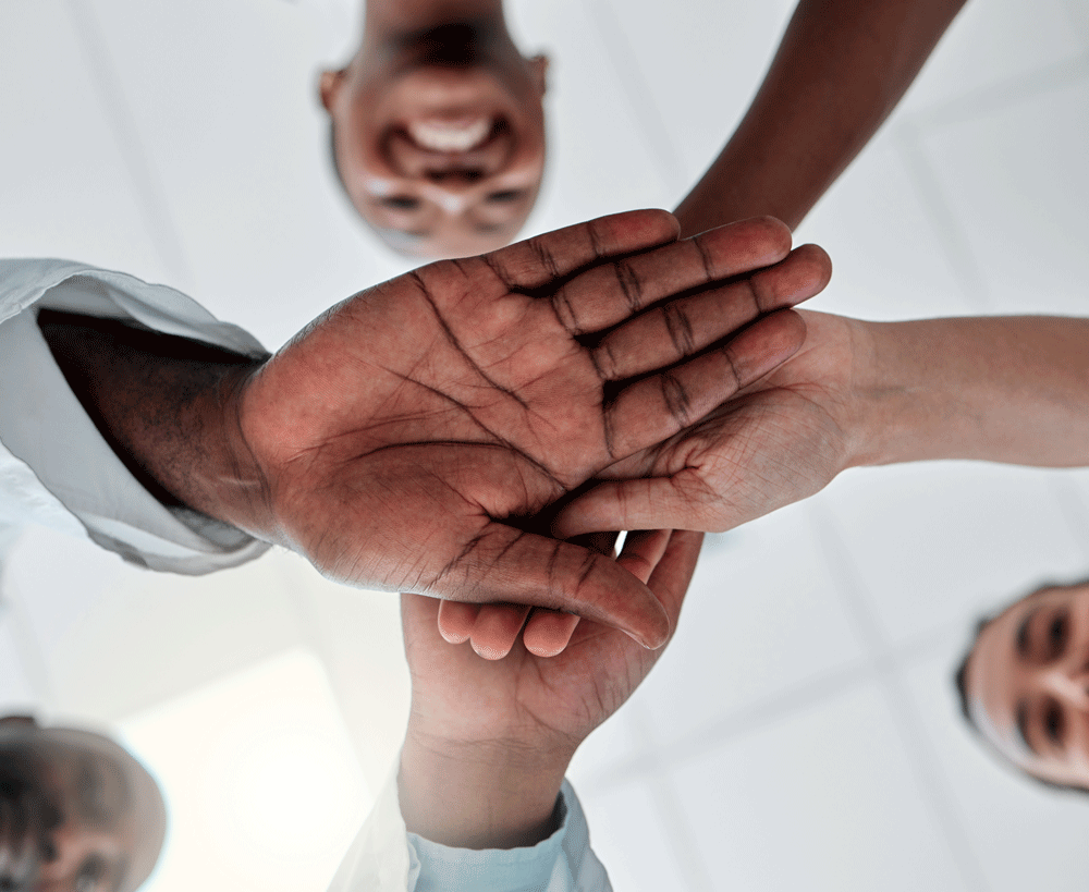Group of doctors and nurses stacking hands Group of doctors and nurses stacking hands