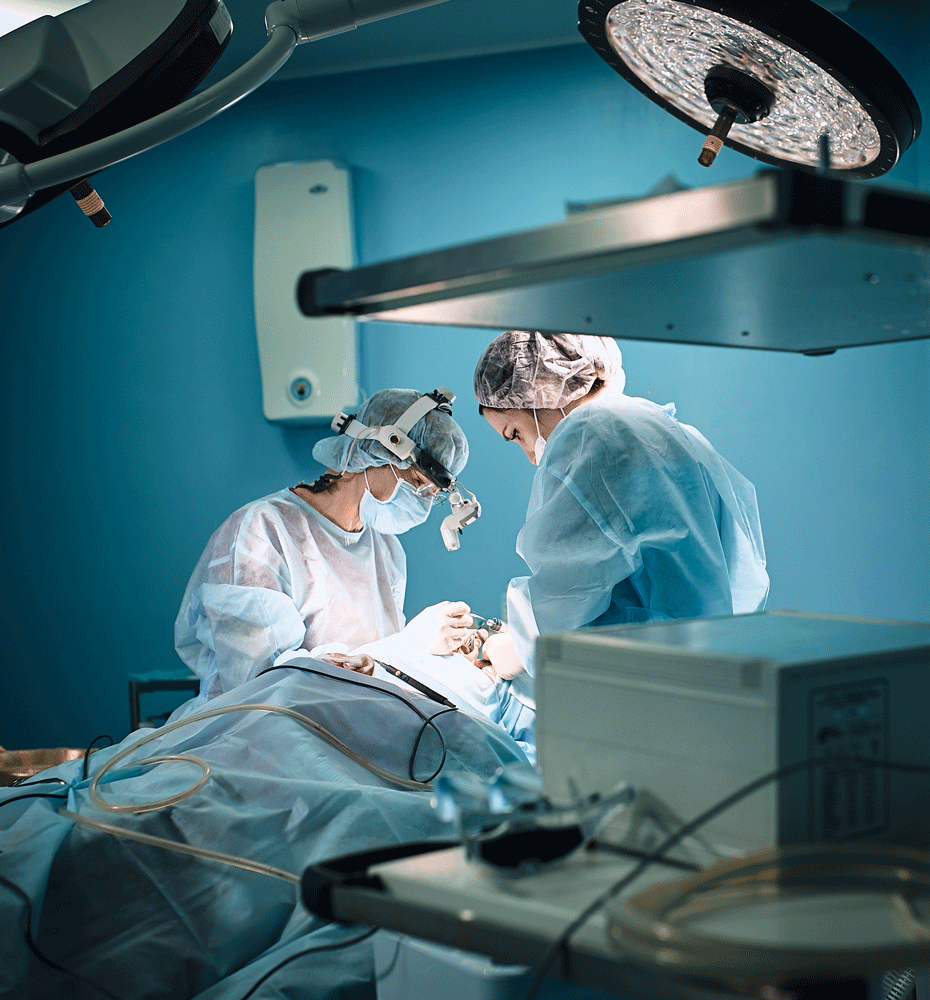 Doctors performing surgery in operating room