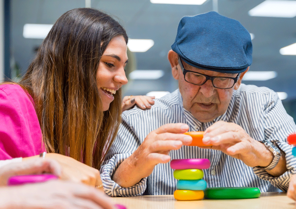 Man and nurse playing game for occupational therapy 