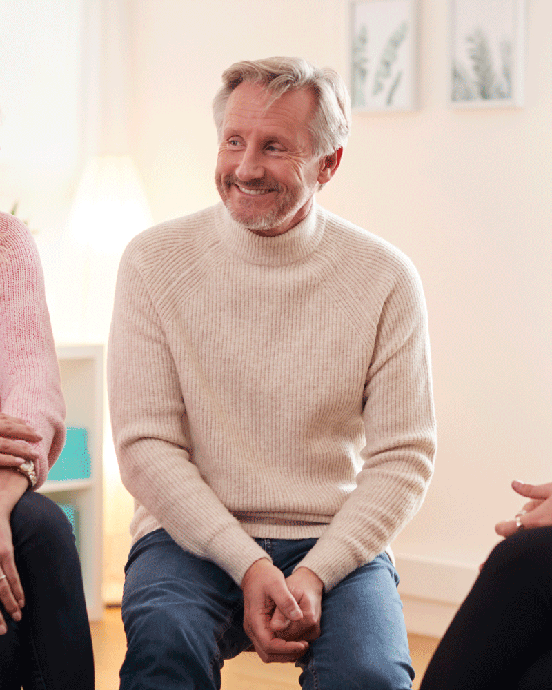 Closeup of man at support group meeting