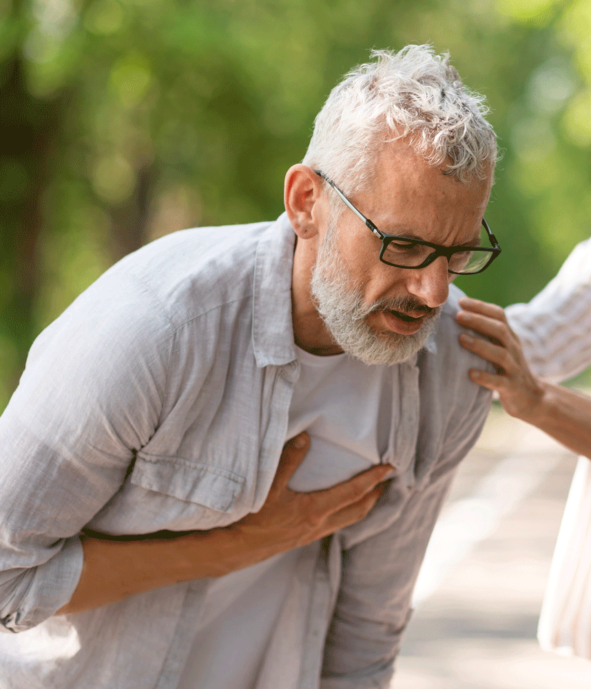 Man suffering from a heart attack in the park