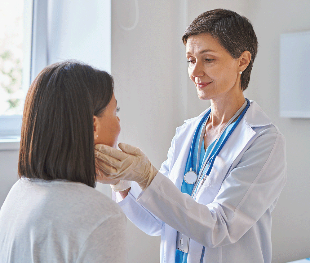 Doctor checking patients lymph nodes in examination