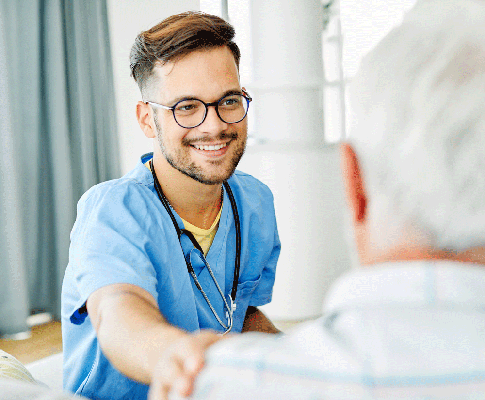Male nurse smiling at patient